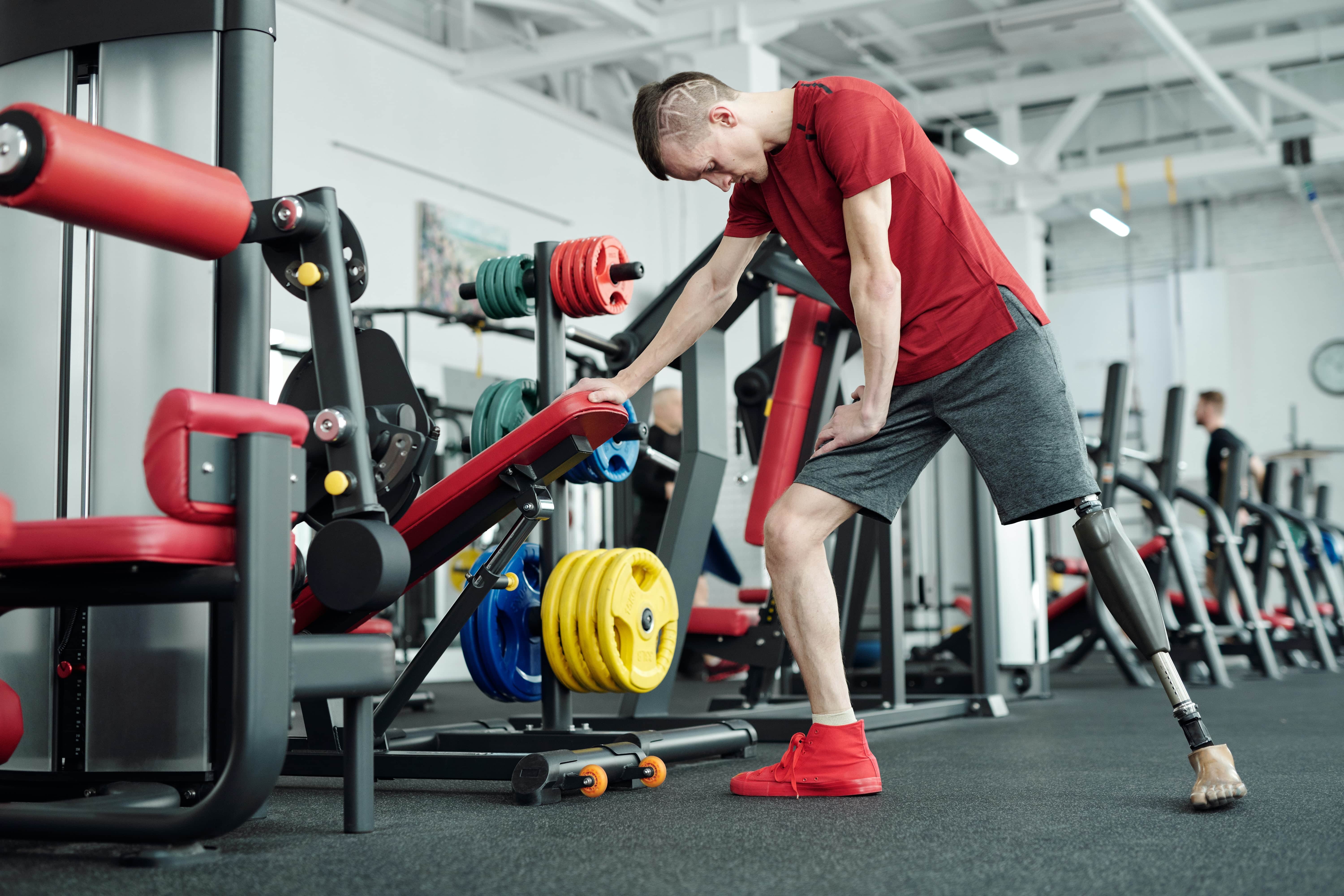Man using weights in gym